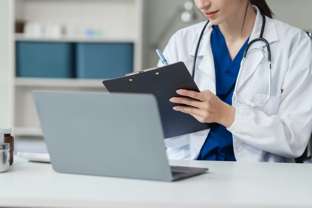 attractive female caucasian female doctor and psychologist gives advice encouragement female asian